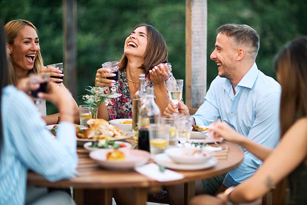 Friends enjoying a dinner party outdoors